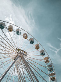 Low angle view of ferris wheel against sky