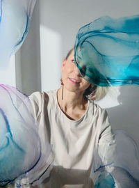 Portrait of a smiling young woman at home