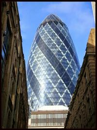 Low angle view of building against blue sky