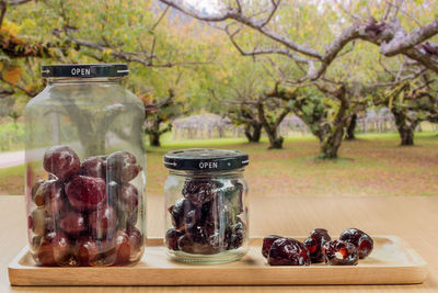 Close-up of fruits in jar on table