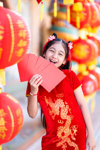 Woman with red lanterns in traditional clothing