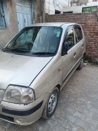 Car parked on street against building