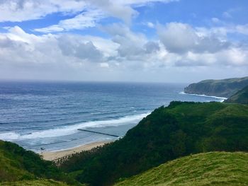 Scenic view of sea against cloudy sky