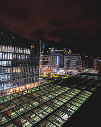 High angle view of illuminated buildings in city at night