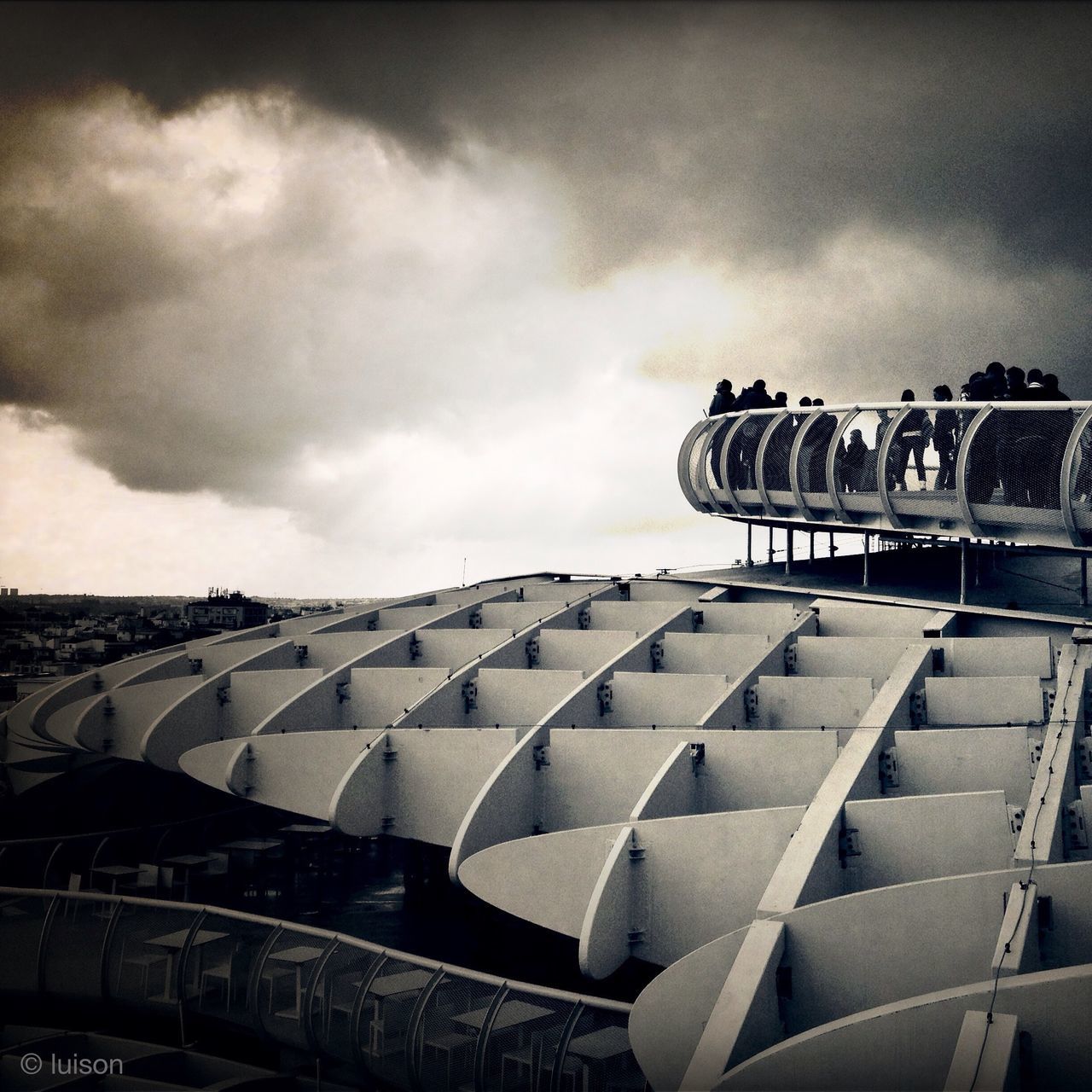 sky, cloud - sky, cloudy, built structure, architecture, low angle view, cloud, building exterior, roof, outdoors, day, in a row, no people, arts culture and entertainment, overcast, pattern, dusk, weather, side by side, design