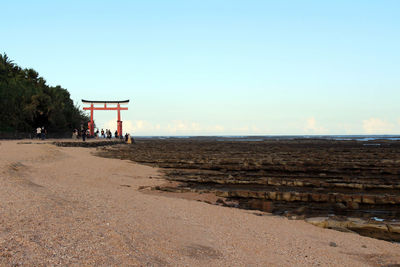 Scenic view of beach against clear sky