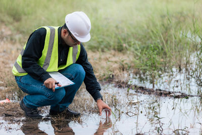 Marine biologist analysing water test results and algea samples