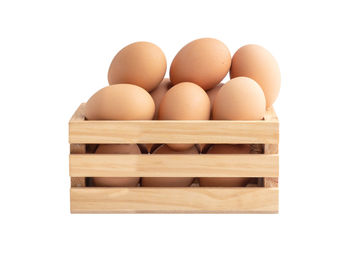 Close-up of eggs against white background