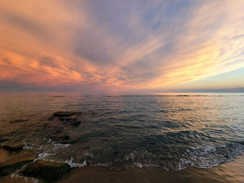 Scenic view of sea against sky during sunset