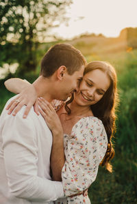 Side view of young woman looking away