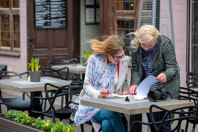 Women sitting on table