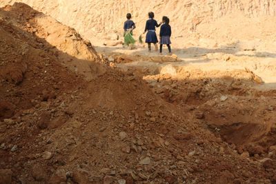 Woman standing on rock formation