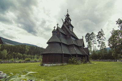 Ancient wooden church in norway landscape photo