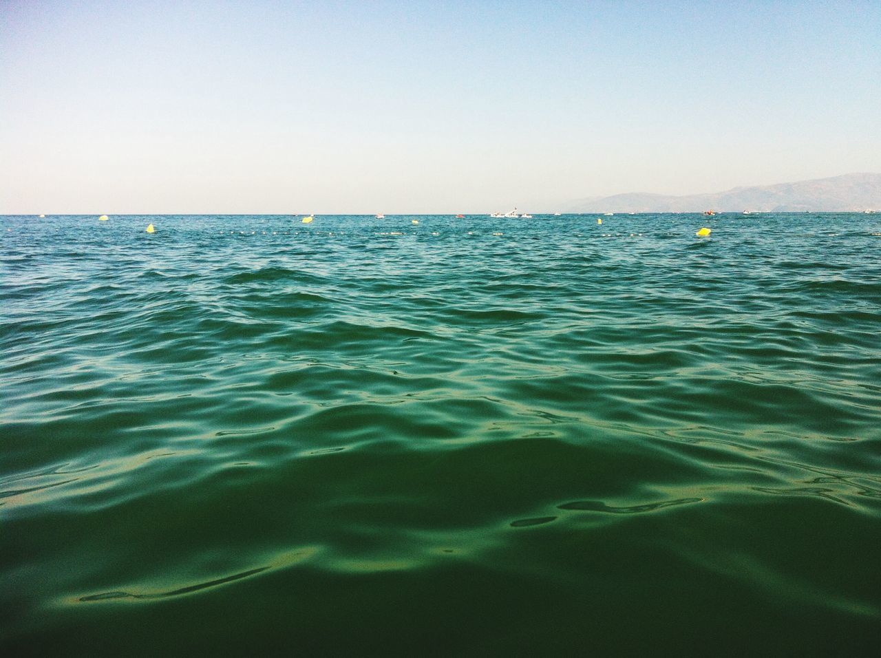 water, sea, clear sky, waterfront, tranquil scene, horizon over water, scenics, tranquility, blue, rippled, beauty in nature, copy space, nature, seascape, idyllic, calm, sky, day, reflection, outdoors