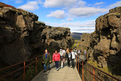 People walking on footbridge