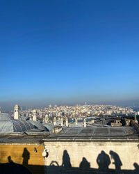 High angle view of townscape against clear blue sky