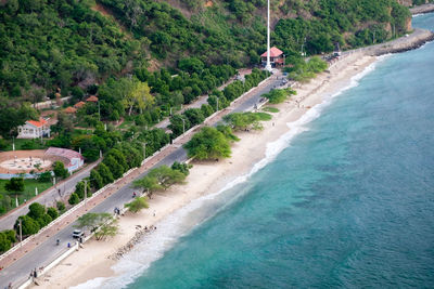 Tropical exotic paradise view of cristo rei beach in dili, timor leste.