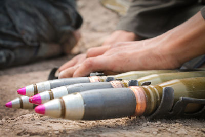 Close up of the soldier fill his weapon ammunition