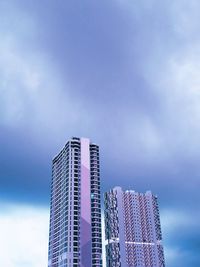 Low angle view of modern buildings against sky