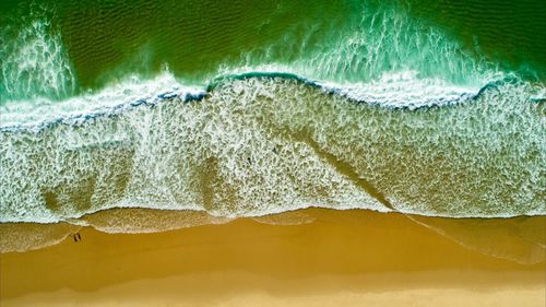 High angle view of surf on beach