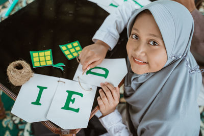 Portrait of young woman holding paper currency