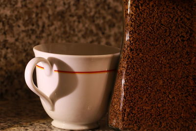 Close-up of coffee cup on table