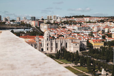 High angle view of buildings in town against sky