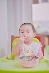 Close-up of cute boy eating food