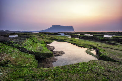 Scenic view of sea against sky during sunset
