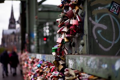 Close-up of padlocks hanging on fence 