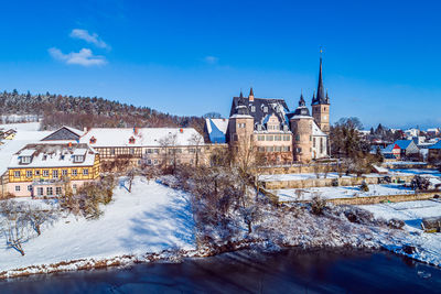 Buildings in city during winter