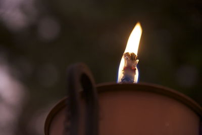 Close-up of illuminated candle