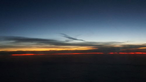 Scenic view of silhouette landscape against sky at sunset