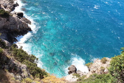 High angle view of rocks in sea