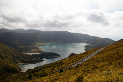 Scenic view of lake and mountains against sky