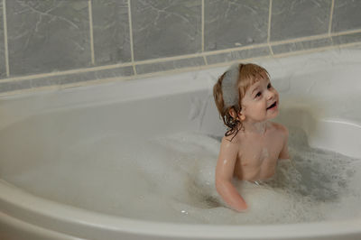 Cute boy in bathtub