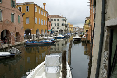 Boats moored in canal