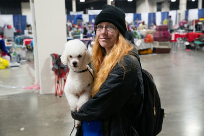 Portrait of young woman with dog