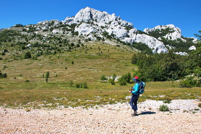 Senior woman hiking in velebit mountain, croatia