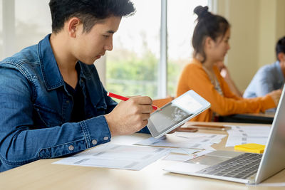 Business colleagues working in office