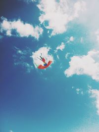 Low angle view of airplane flying in sky