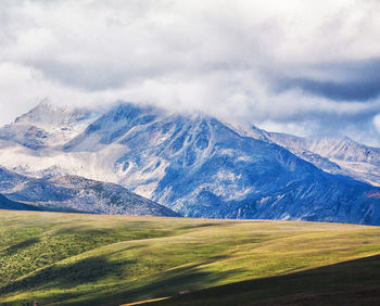 Scenic view of snowcapped mountains against sky