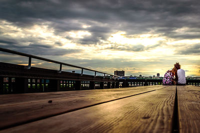 View of bridge against cloudy sky