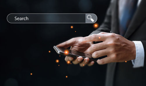 Close-up of hand holding smart phone