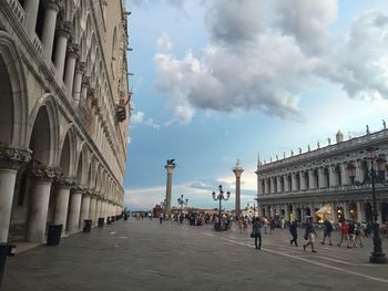 People at st mark square against sky