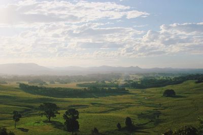 Scenic view of landscape against cloudy sky