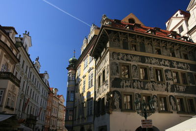 Low angle view of buildings against blue sky