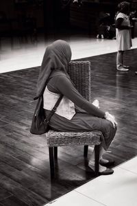 Woman sitting on floor