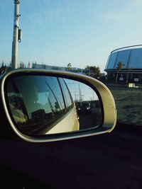 Reflection of car on side-view mirror