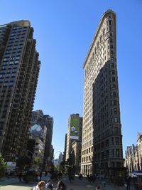 Low angle view of modern office building against sky